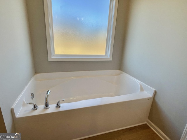 full bathroom featuring a garden tub