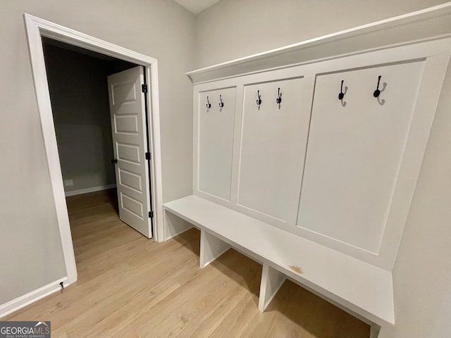 mudroom with light wood-type flooring and baseboards