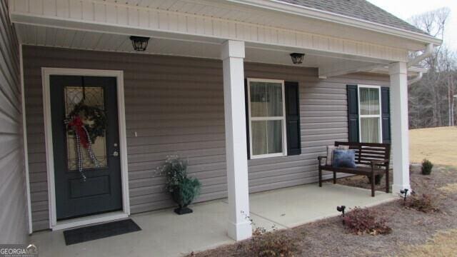 property entrance with a porch