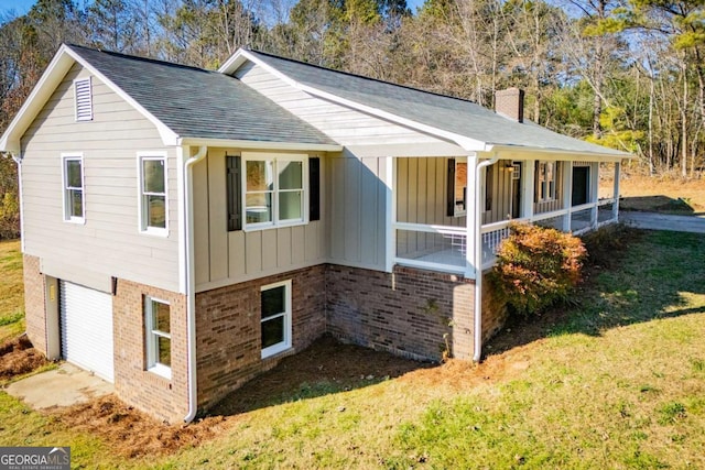 view of property exterior with a porch and a yard