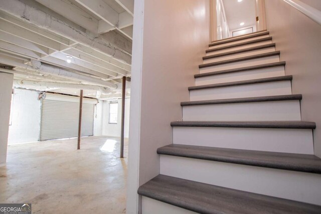 stairs with concrete floors