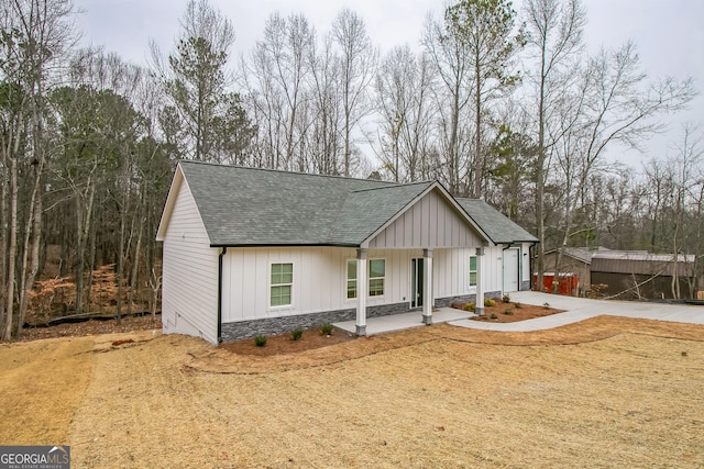 modern farmhouse style home with a porch