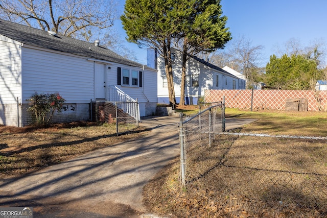 view of front of property featuring entry steps, a shingled roof, crawl space, and fence