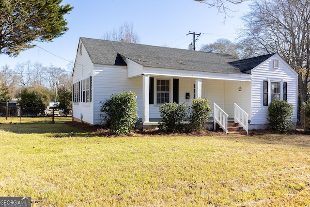 view of front facade with covered porch and a front yard