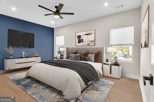 bedroom featuring ceiling fan and light hardwood / wood-style floors