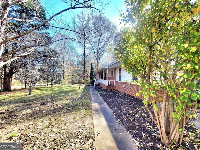 view of home's exterior with brick siding