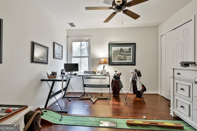 home office featuring ceiling fan and dark wood-type flooring