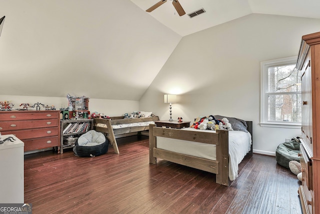 bedroom with ceiling fan, dark hardwood / wood-style floors, and lofted ceiling