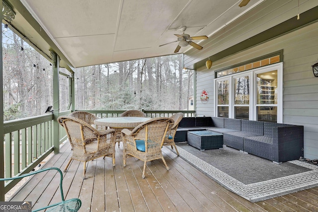 exterior space with outdoor lounge area and ceiling fan