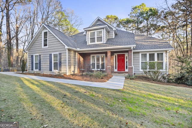 new england style home with a front yard