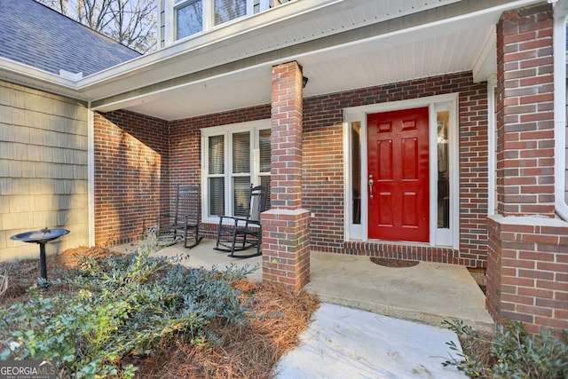 doorway to property with a porch