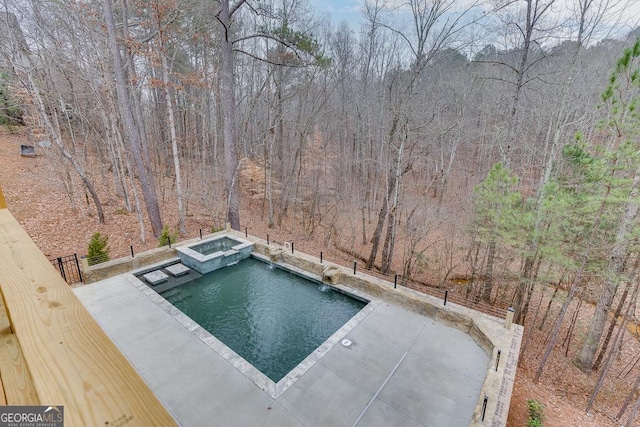 view of swimming pool with an in ground hot tub and a patio