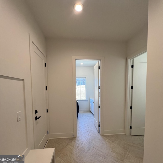 hall with light parquet floors