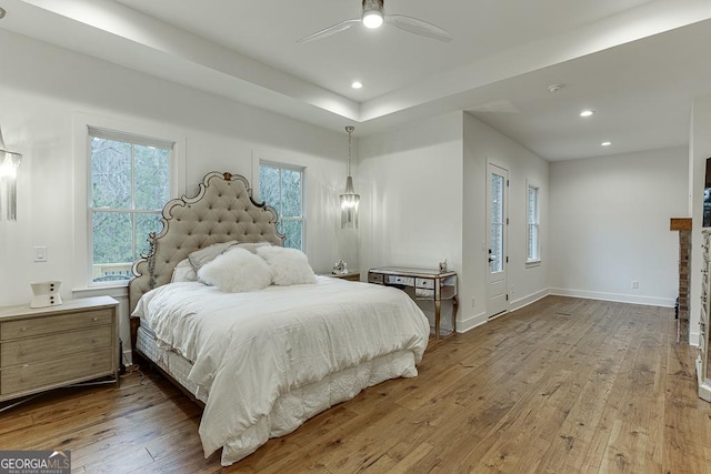 bedroom featuring hardwood / wood-style floors and ceiling fan