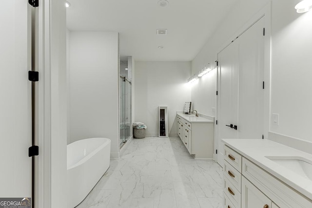 bathroom with vanity and independent shower and bath