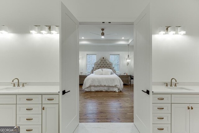 bathroom with vanity, wood-type flooring, and ceiling fan