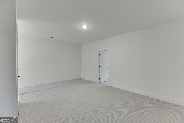 spare room with light carpet