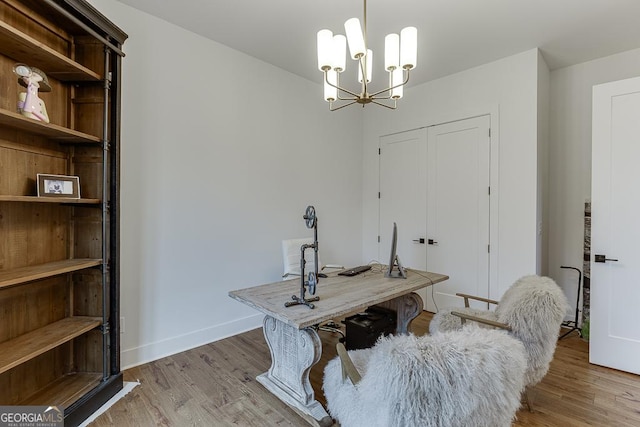 office space with hardwood / wood-style floors and a notable chandelier