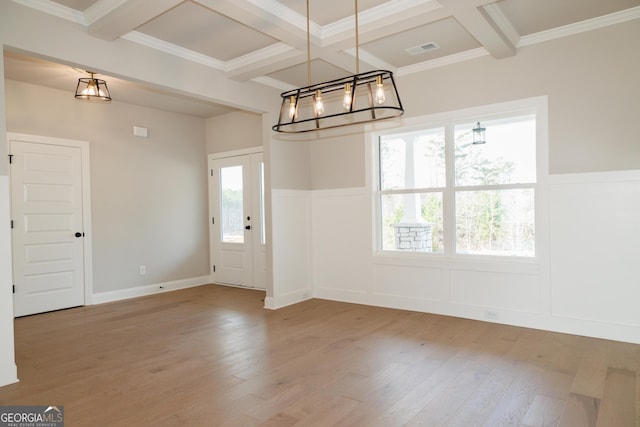 entryway featuring hardwood / wood-style flooring, crown molding, coffered ceiling, and beamed ceiling