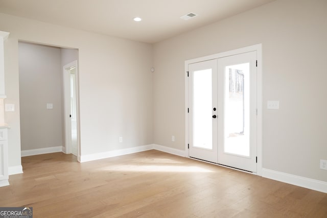 interior space featuring light hardwood / wood-style floors and french doors