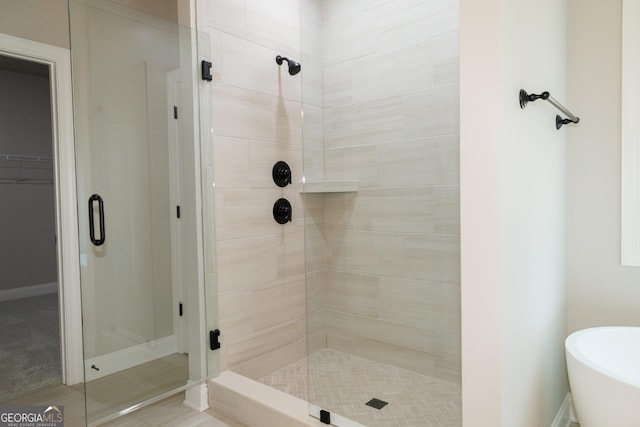 bathroom with separate shower and tub