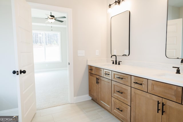 bathroom with ceiling fan and vanity