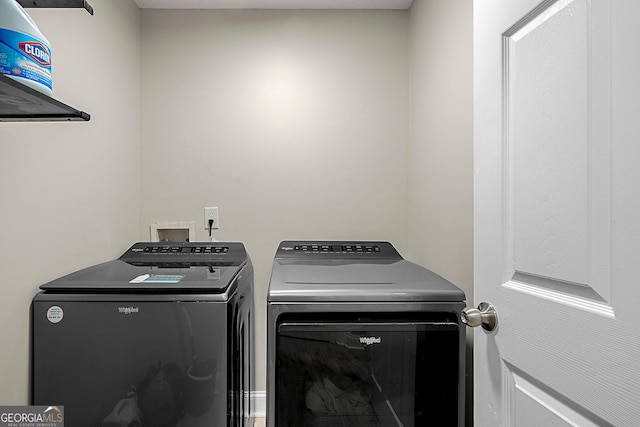 laundry area with independent washer and dryer