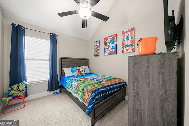 bedroom with carpet flooring, ceiling fan, and lofted ceiling