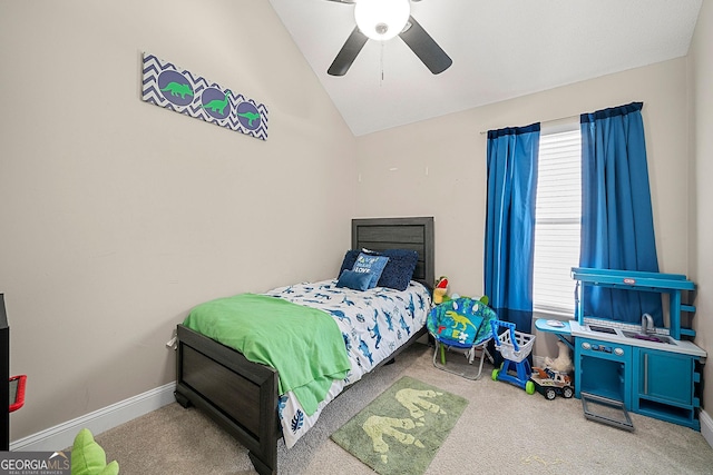 carpeted bedroom featuring vaulted ceiling and ceiling fan