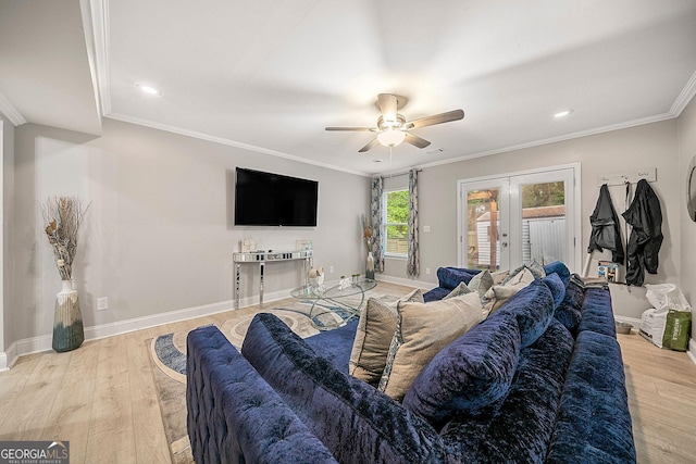 living room with french doors, light wood-type flooring, ceiling fan, and crown molding