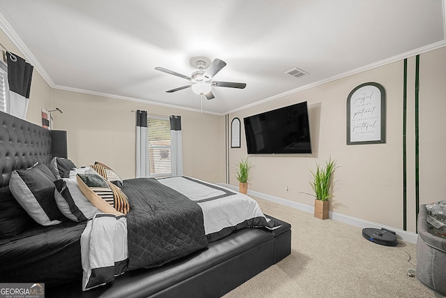 carpeted bedroom featuring ceiling fan and ornamental molding