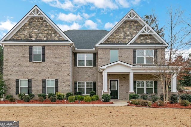 craftsman inspired home with a front yard