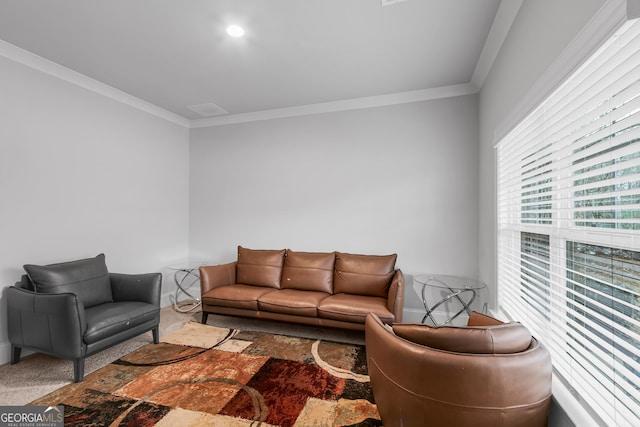 carpeted living room featuring ornamental molding