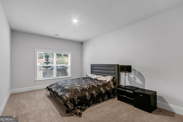 bedroom with light carpet