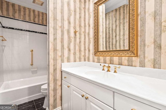 full bathroom featuring toilet, vanity, tile patterned floors, and tiled shower / bath combo