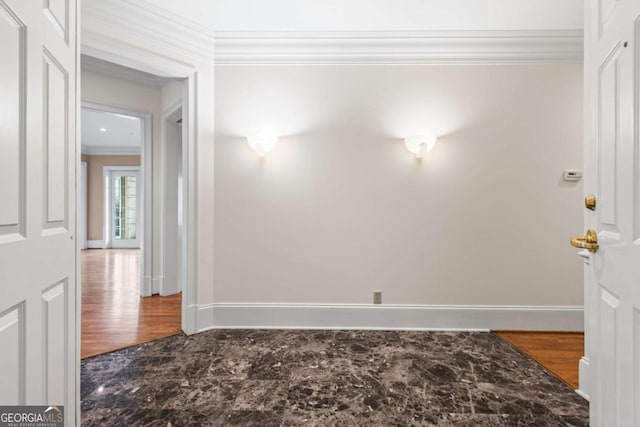 empty room featuring ornamental molding