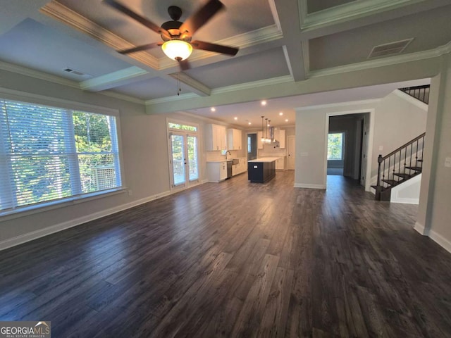 unfurnished living room with french doors, coffered ceiling, ceiling fan, dark hardwood / wood-style floors, and beam ceiling