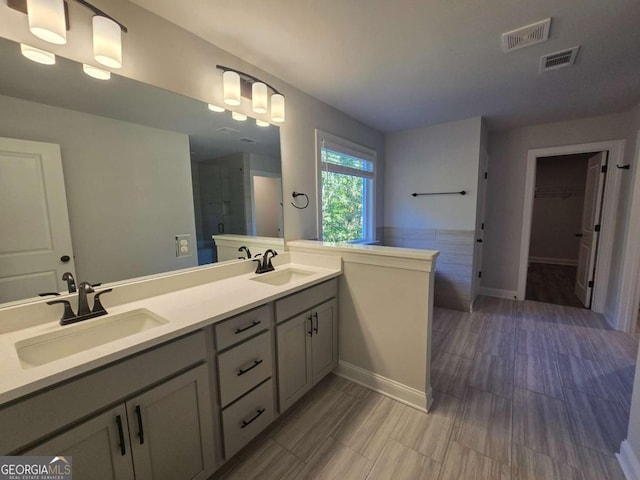 bathroom with vanity and an enclosed shower