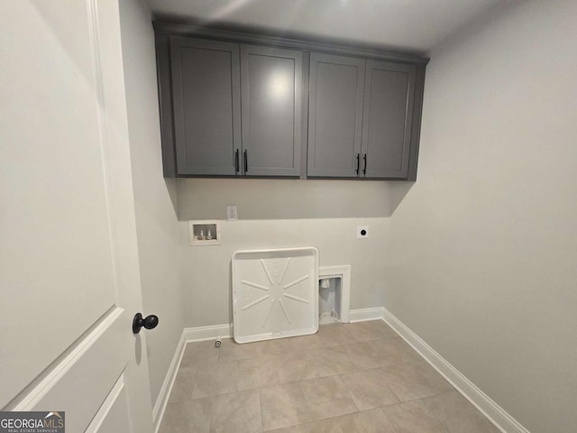 laundry room featuring hookup for an electric dryer, light tile patterned flooring, cabinets, and hookup for a washing machine