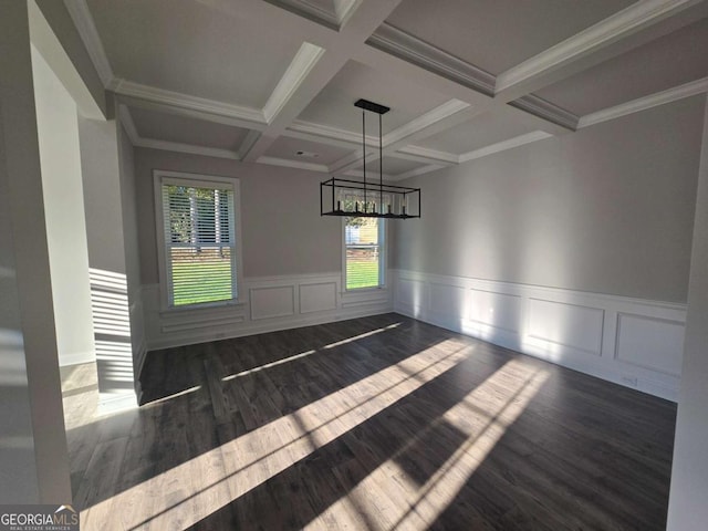 unfurnished dining area with beam ceiling, dark wood-type flooring, coffered ceiling, and ornamental molding