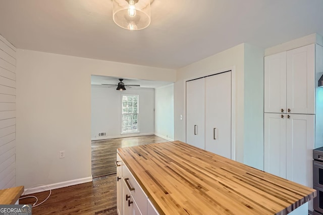 unfurnished bedroom featuring dark hardwood / wood-style flooring and a closet