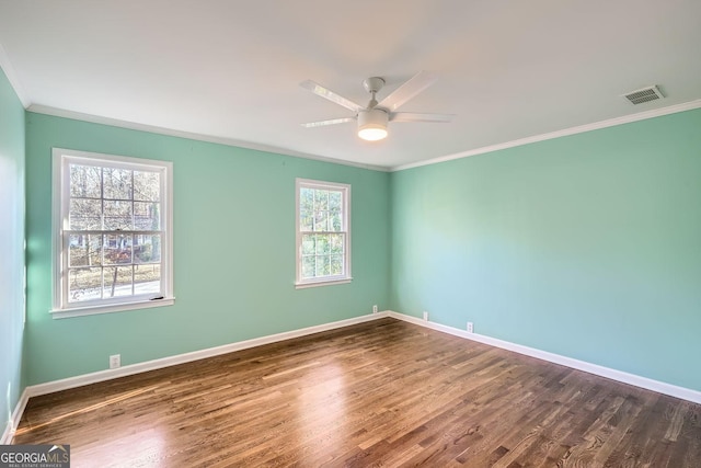 unfurnished room featuring ceiling fan, a healthy amount of sunlight, and ornamental molding