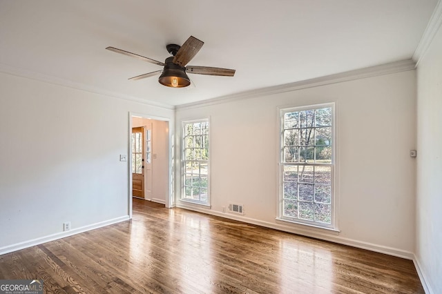 unfurnished room with ceiling fan, wood-type flooring, and crown molding