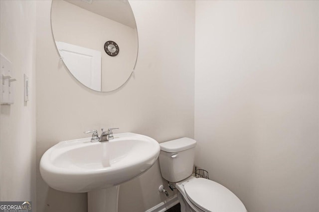 bathroom with toilet and sink