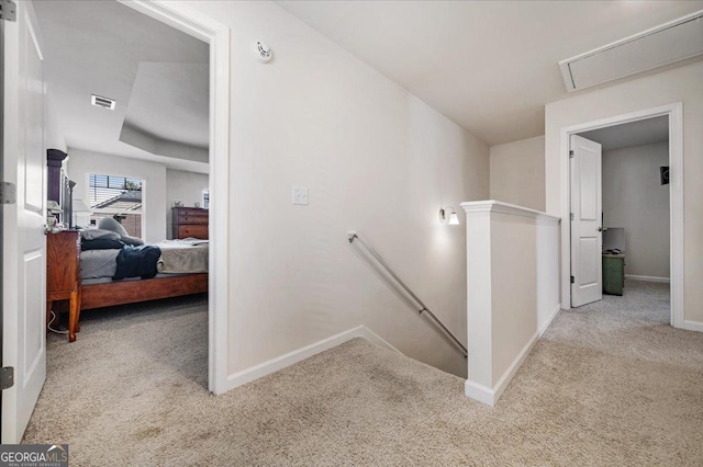 stairs featuring carpet flooring