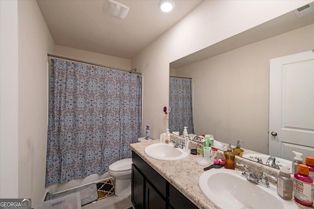 bathroom with vanity and toilet