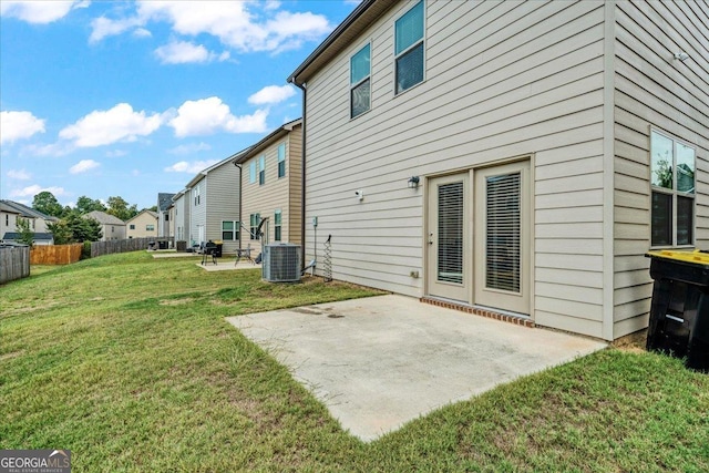 back of house featuring a yard, a patio, and cooling unit