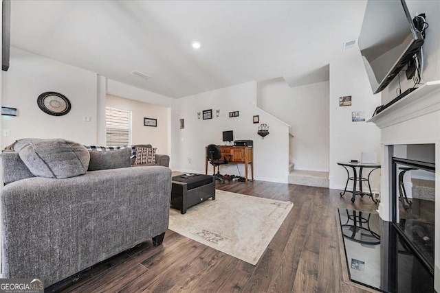 living room with dark hardwood / wood-style flooring