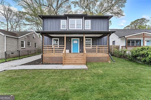 view of property with covered porch and a front lawn