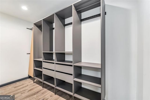 walk in closet featuring wood-type flooring